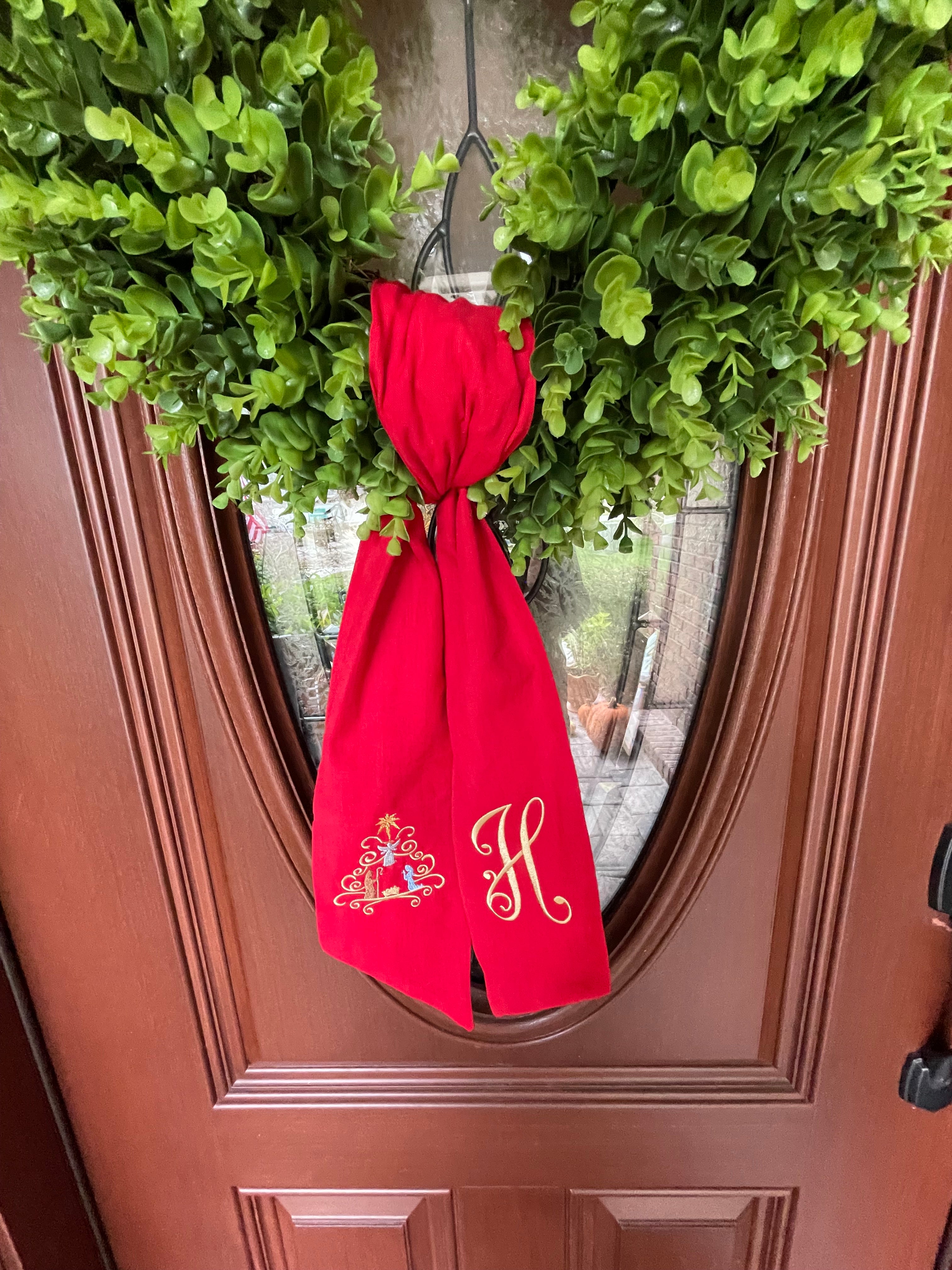 Personalized Embroidered Christmas Wreath Sash With Manger Scene on Red Sash