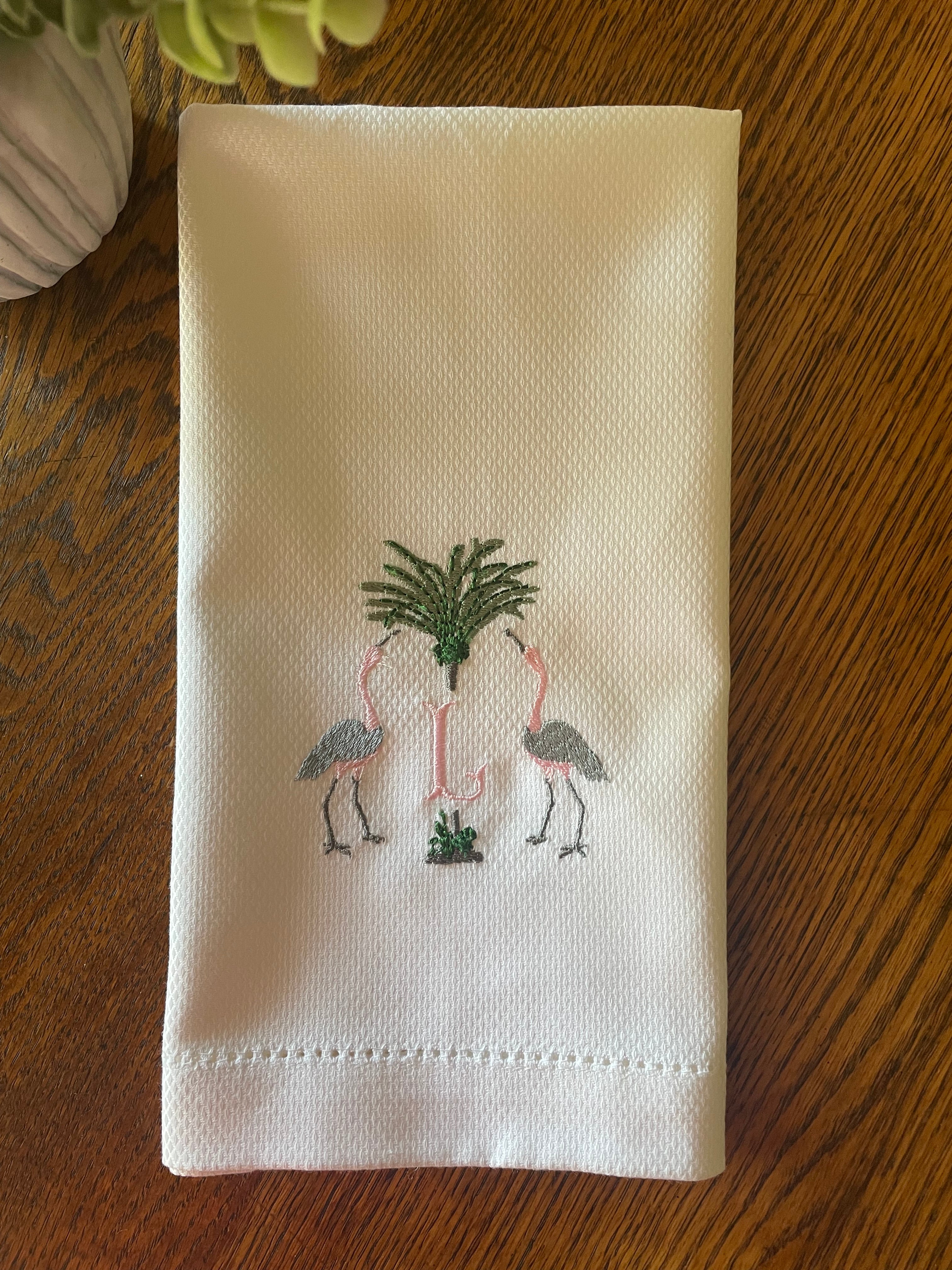 Huck Towel That Is Personalized, Embroidered Cranes and Palm Trees, and an Initial in the Middle
